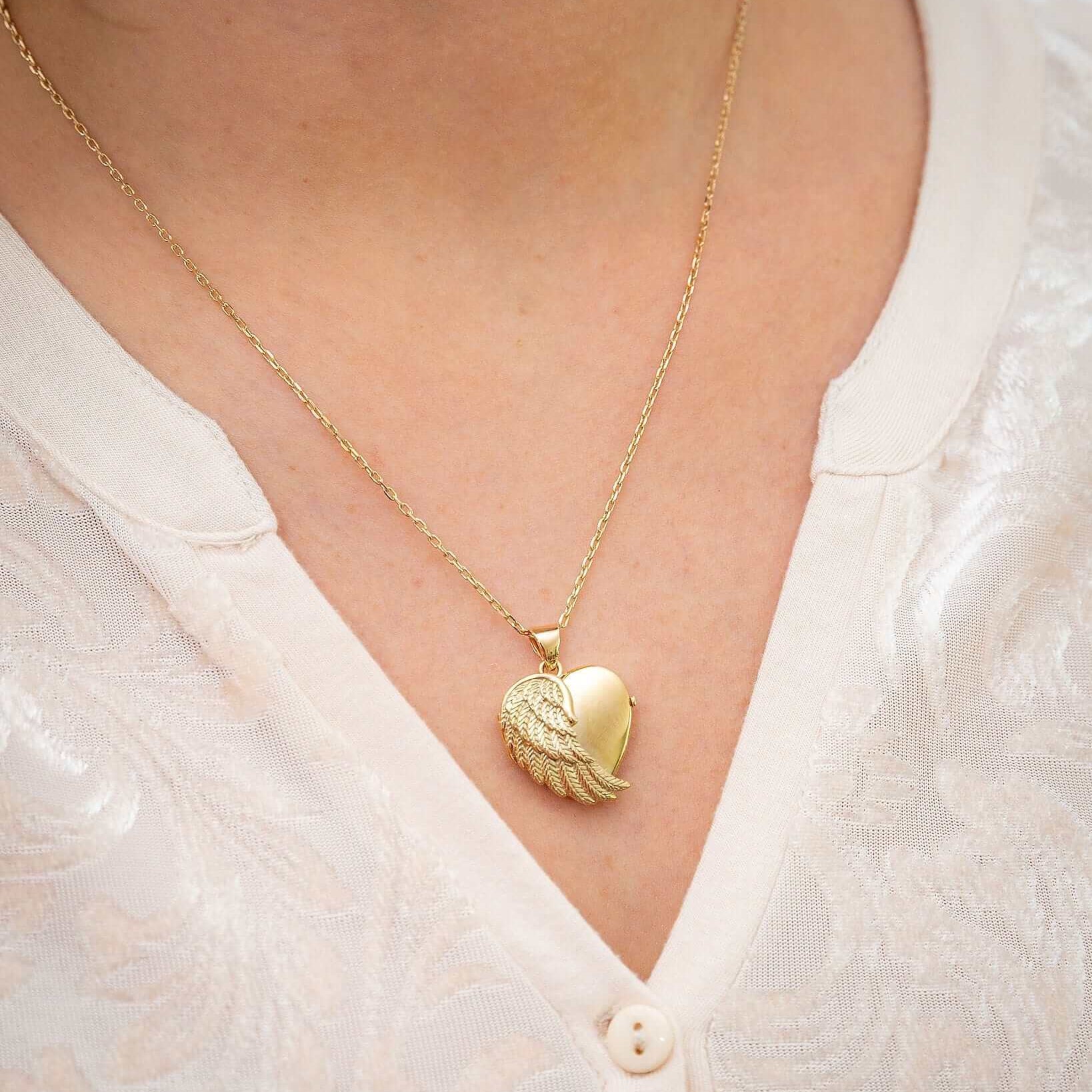 Cara Keepsakes Gold Locket Urns Gold Angel Wing Locket Urn worn on model