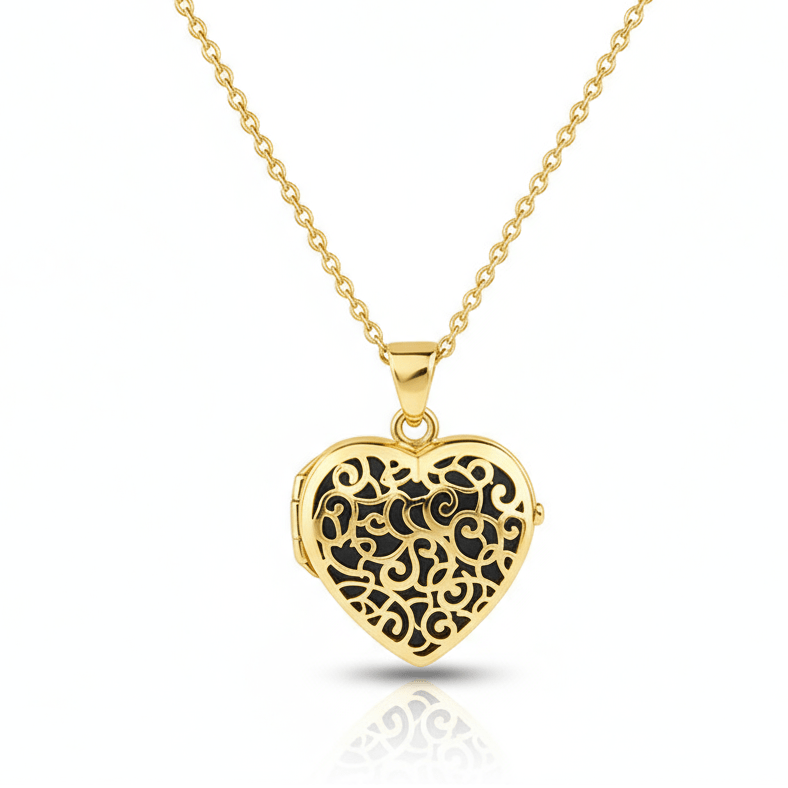 Gold heart-shaped urn necklace with intricate filigree design on a white background